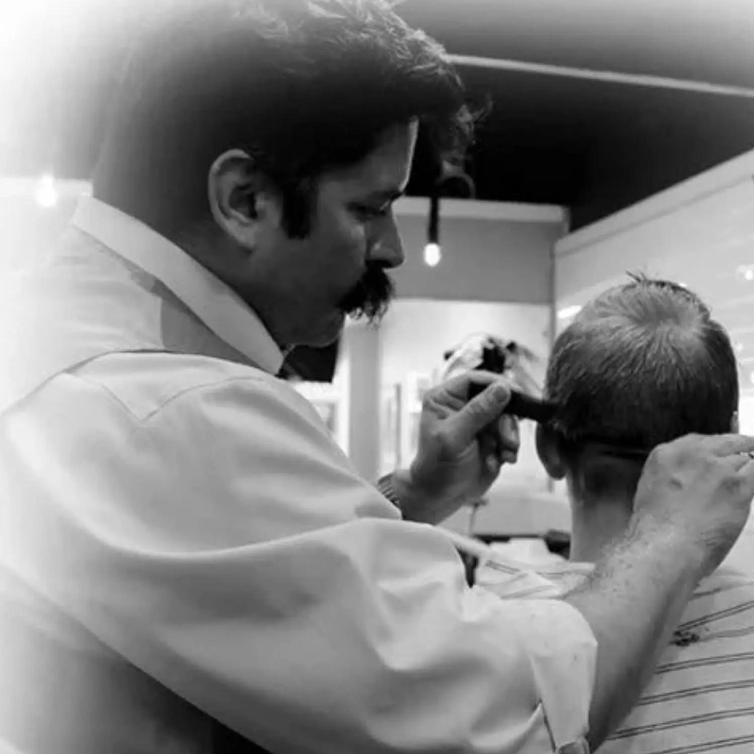 This image showcases DANIAL professional hair cutting scissors made of stainless steel, ideal for salon, barber, and home use for men and women.