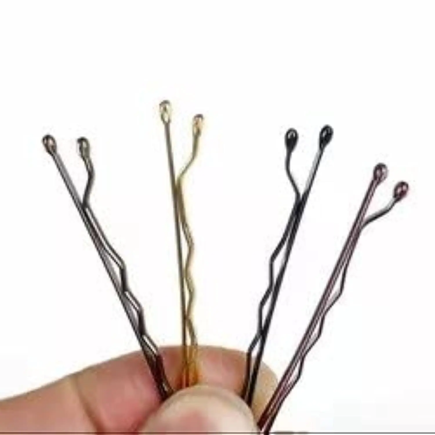 A set of dark grey hair pins provides a secure, non-slip grip for creating elegant updos and various hairstyles on both thick and thin hair.