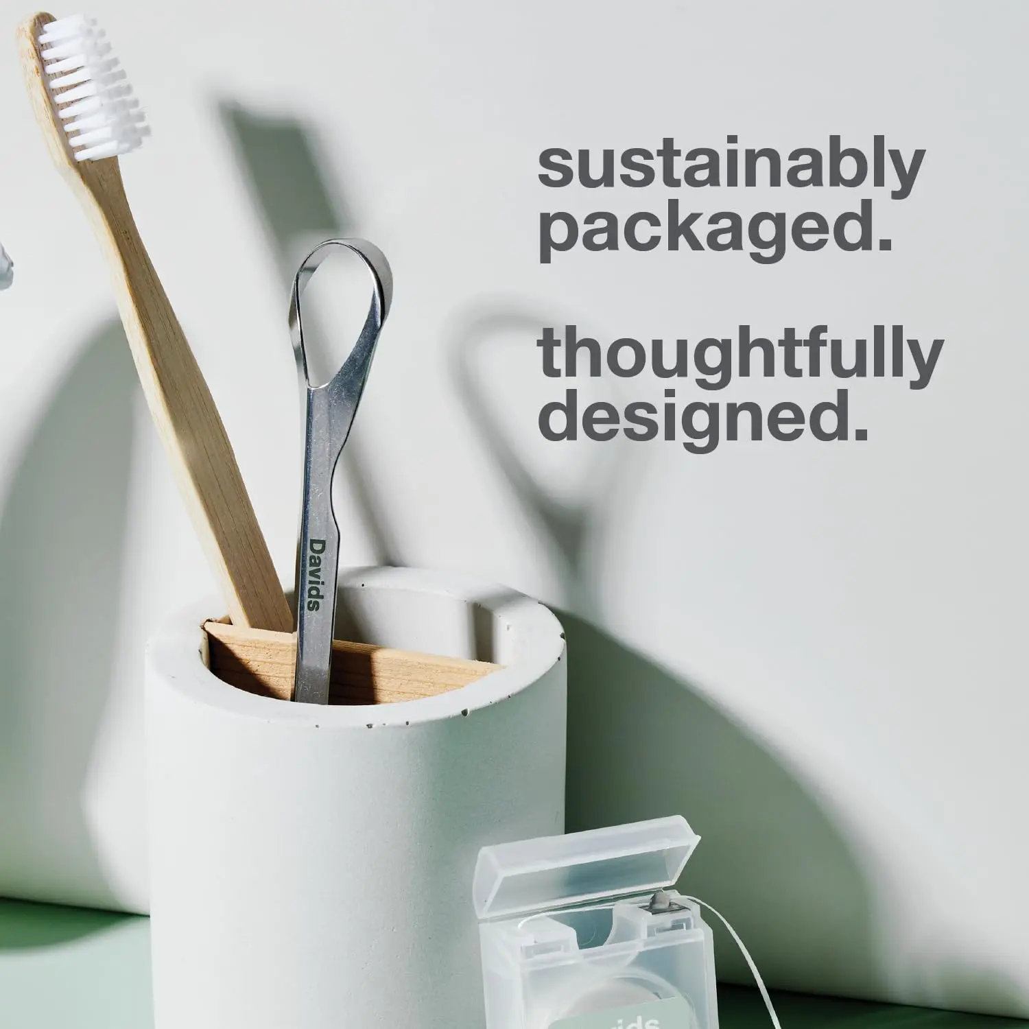 This stainless steel tongue scraper by Davids gently removes debris for improved oral hygiene and fresher breath, made in the USA.