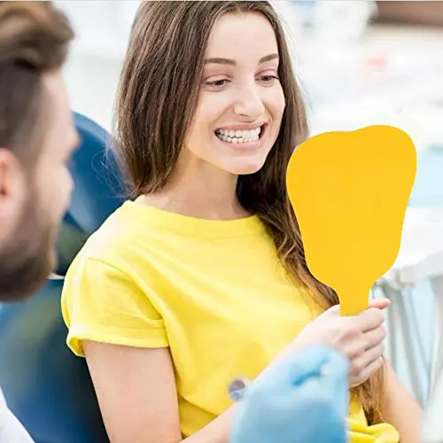 Yellow handled dental mouth mirror for inspecting teeth at home or in a clinic.