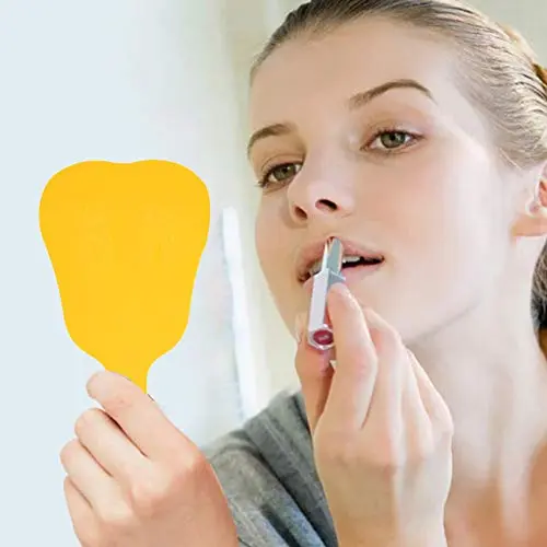 Yellow handled dental mouth mirror for inspecting teeth at home or in a clinic.
