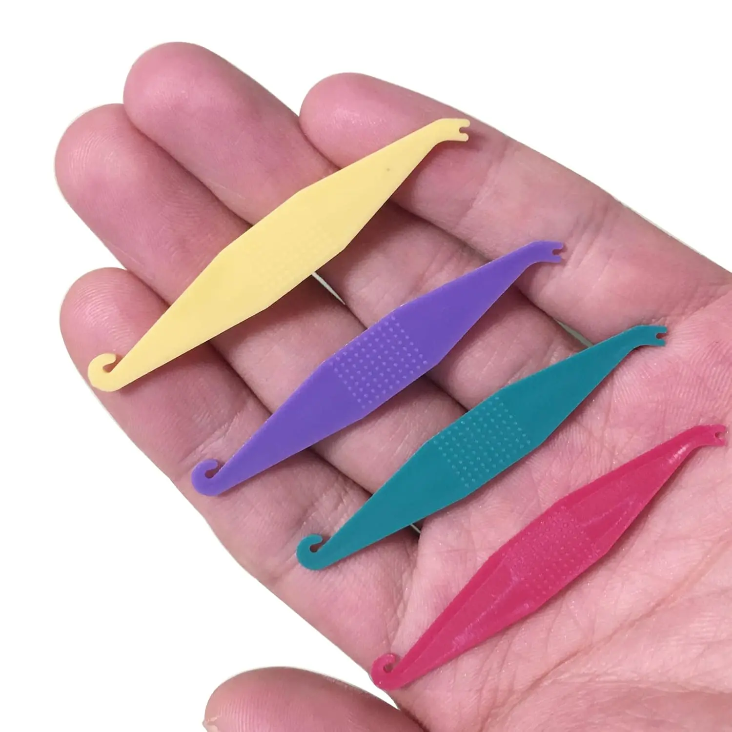 This pack of 20 multi-colored dental elastic placers are disposable tools designed to easily apply and remove rubber bands on braces, making orthodontic treatment more convenient.