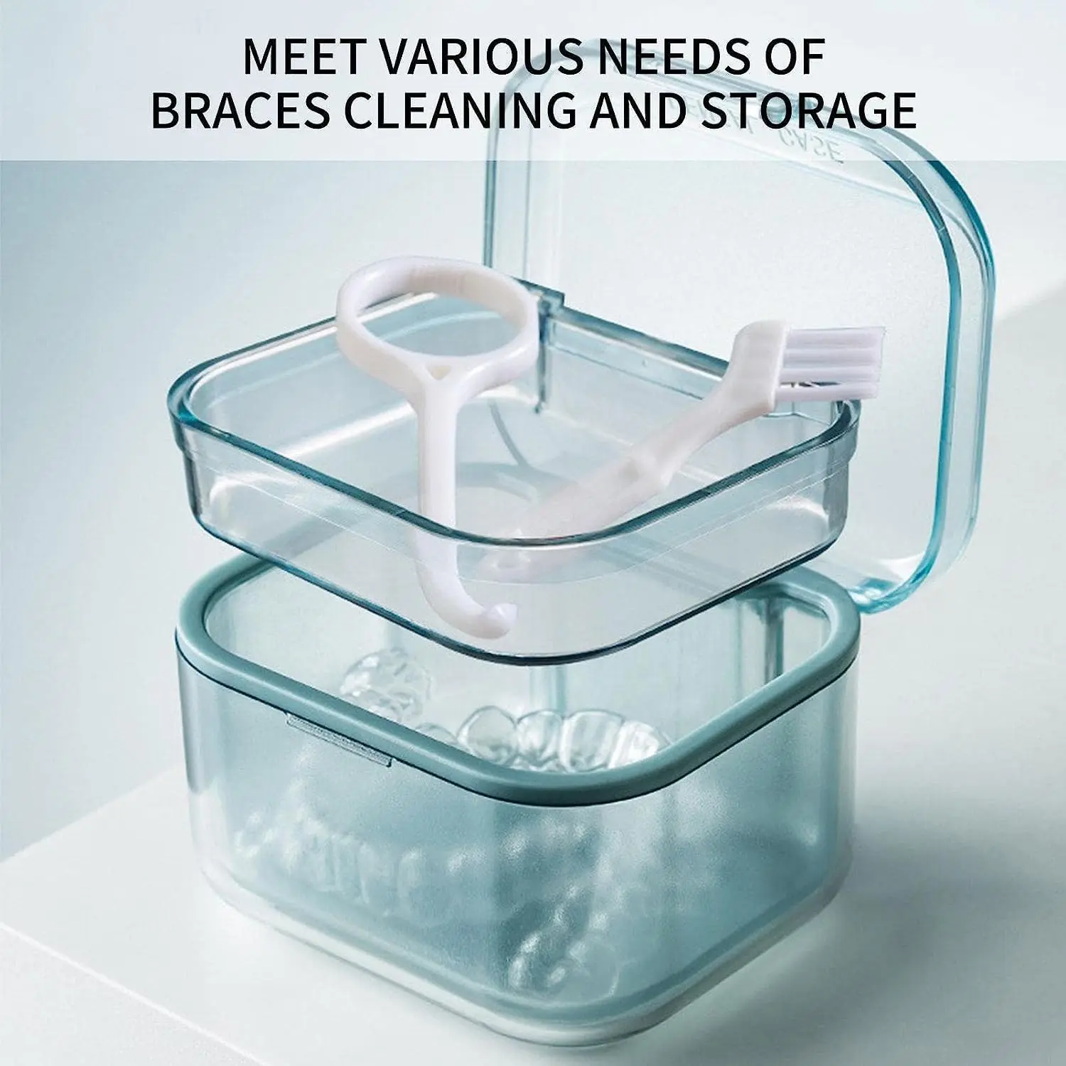 This blue denture bath box features a three-layer separation and includes a retainer case and soak container for easy denture cleaning and storage.