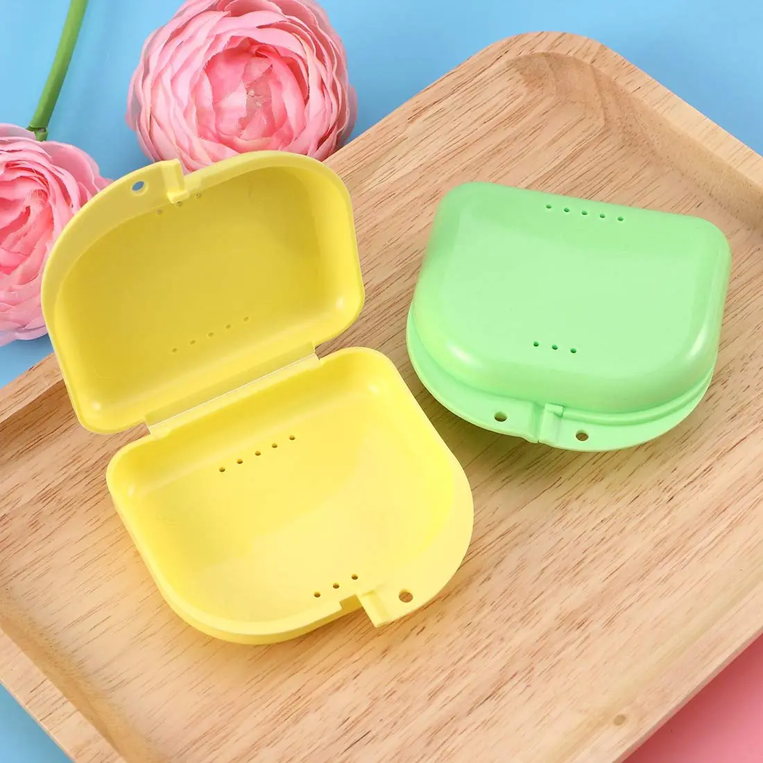 This 5-pack of colorful denture cases with keychains provides convenient and odor-proof storage for dentures, retainers, mouth guards, and other dental appliances.