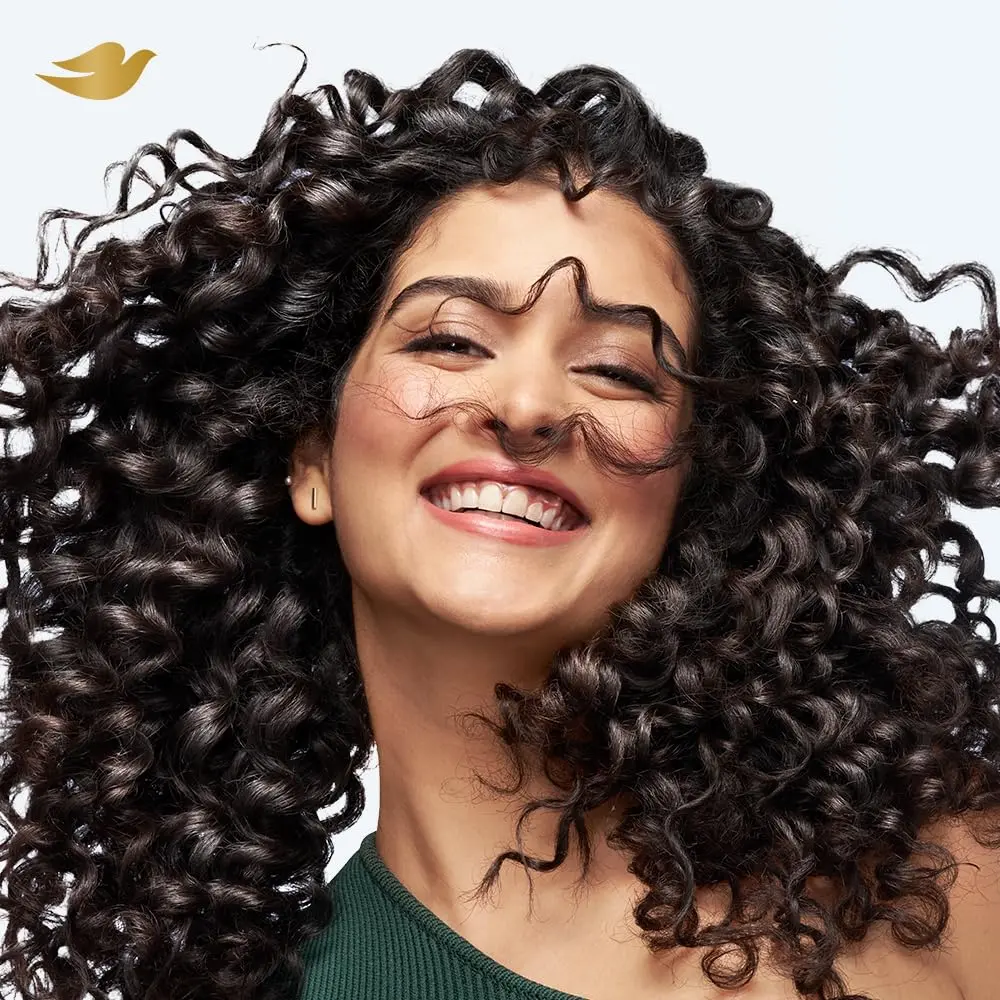 Dove Beautiful Curls deep moisture hair mask with aloe, shea butter and coconut oil hydrates and nourishes curly hair, reducing frizz and dryness.
