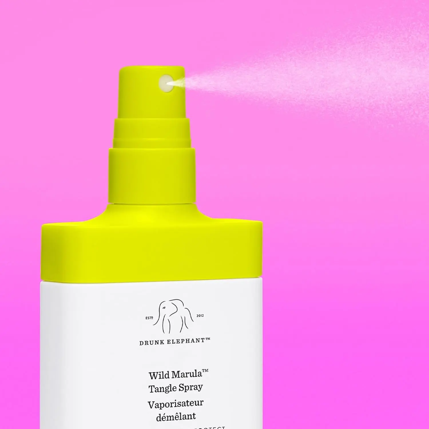 A bottle of Drunk Elephant Wild Marula Tangle Spray, a weightless leave-in mist that detangles hair, provides heat protection, and restores shine without silicones.