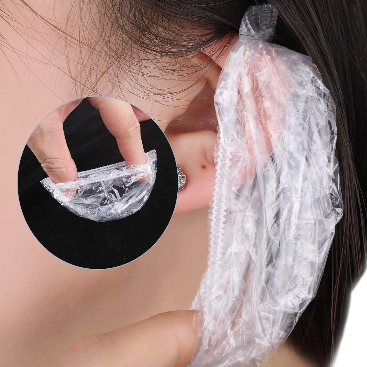 A pack of 100 clear, disposable plastic ear covers designed to protect ears from water during showers, hair coloring, and salon treatments, featuring a comfortable and elastic fit for both men and women.
