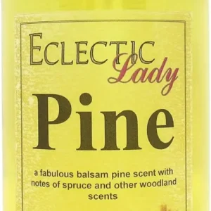 A bottle of Eclectic Lady Pine Bath Oil offers a captivating balsam pine fragrance with spruce and woodland notes, reminiscent of a fresh Christmas tree.