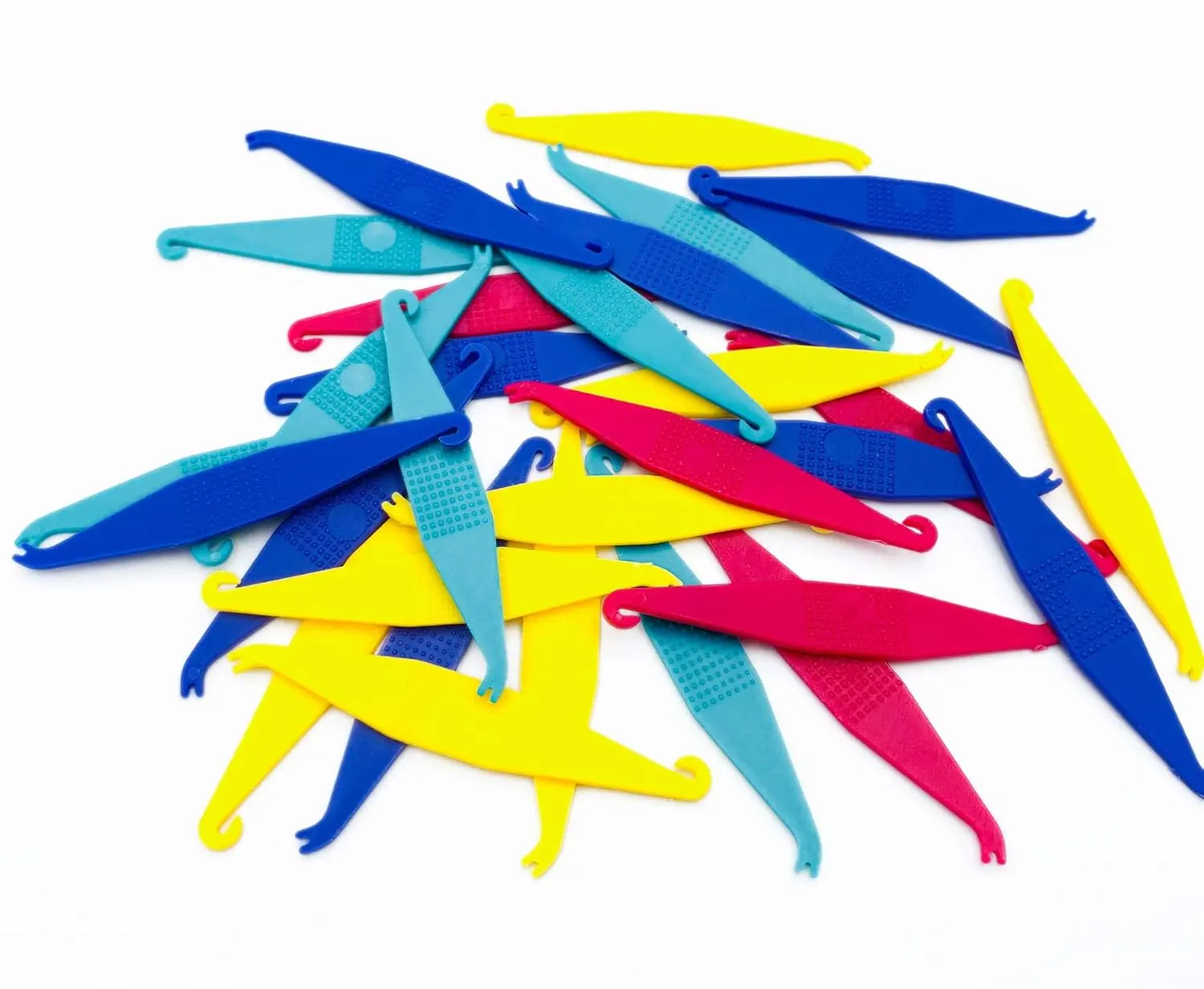 This image shows multi-colored disposable plastic orthodontic elastic placers designed to easily fit and remove rubber bands on braces.
