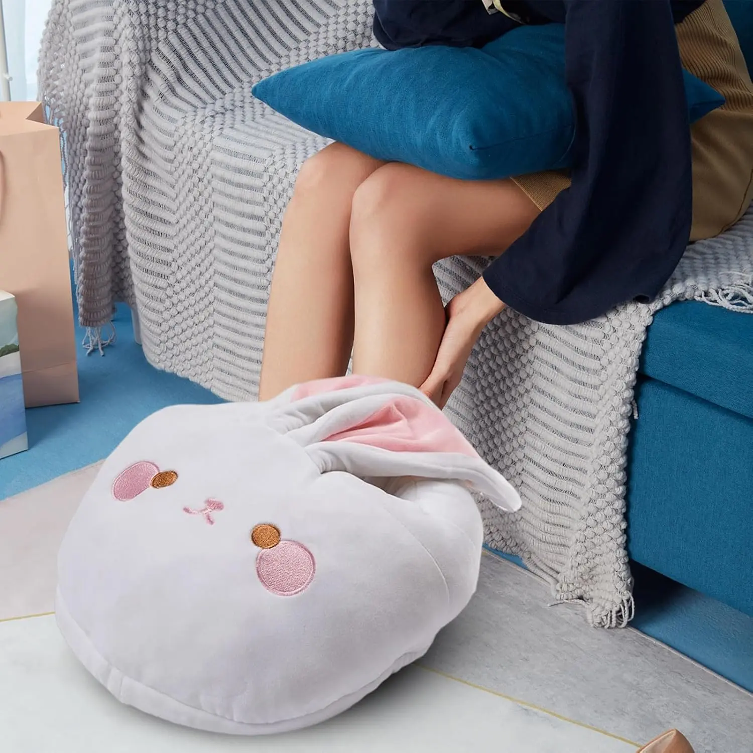 An electric foot warmer heating pad provides instant and consistent warmth with breathable fabric and overheat protection, perfect for home or office use during winter.