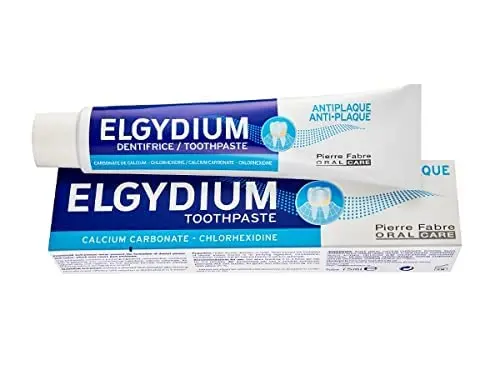 Two 75ml tubes of Elgydium anti-plaque toothpaste for adults, formulated with calcium carbonate to help prevent plaque buildup with regular brushing.