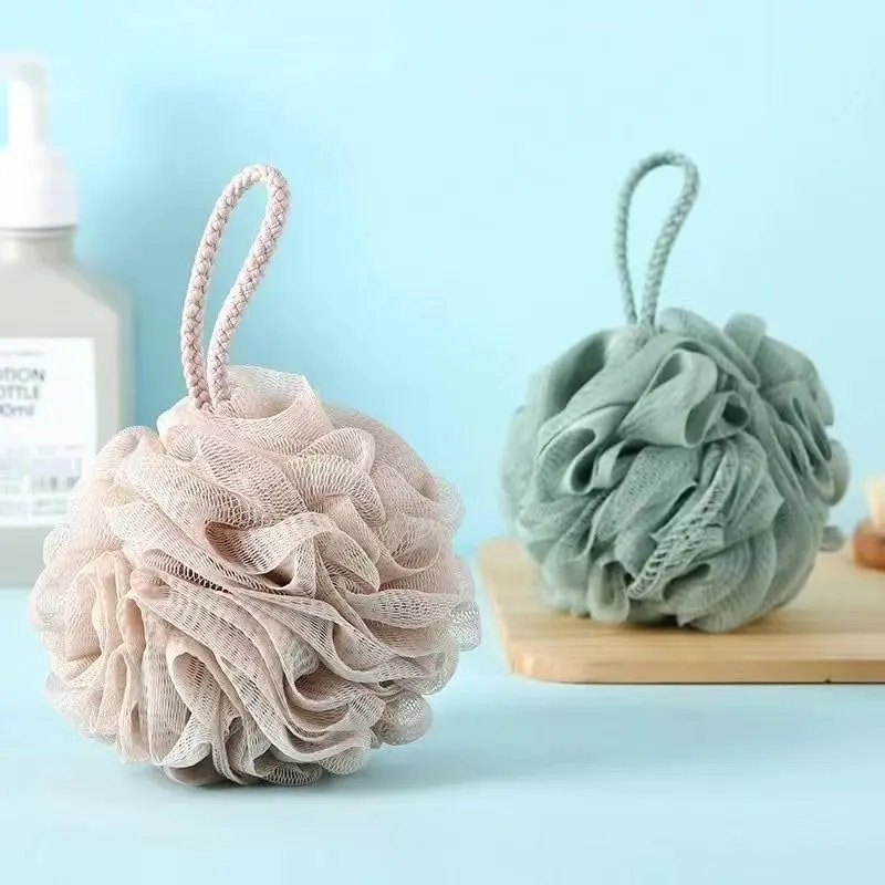 Double-sided exfoliating bath mitts in assorted vibrant colors gently remove dead skin cells and improve circulation for both men and women.