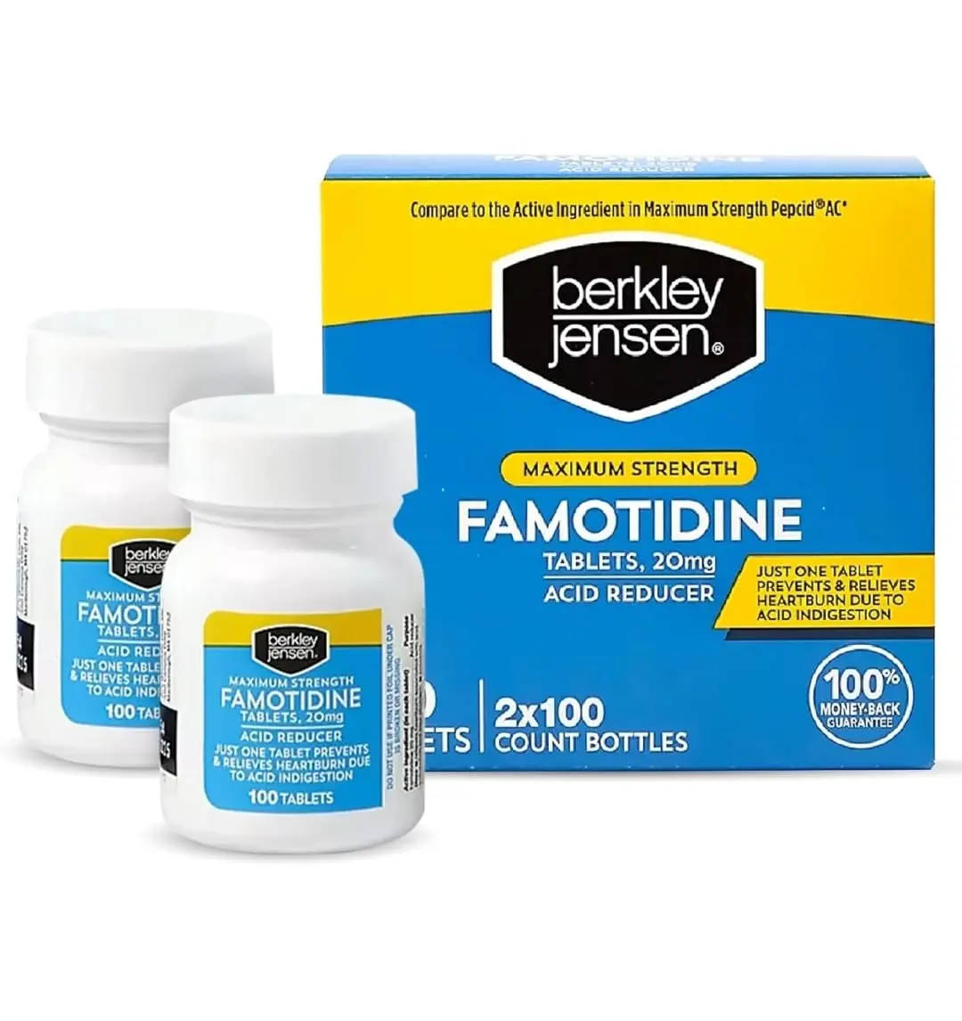 Two bottles of Berkley and Jensen Maximum Strength Famotidine 20mg tablets for heartburn relief are shown.