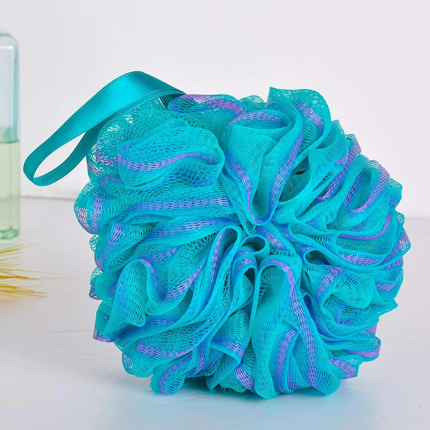 This image shows a four-pack of FITTO bath sponges designed for gentle exfoliation and creating a rich lather in the shower.