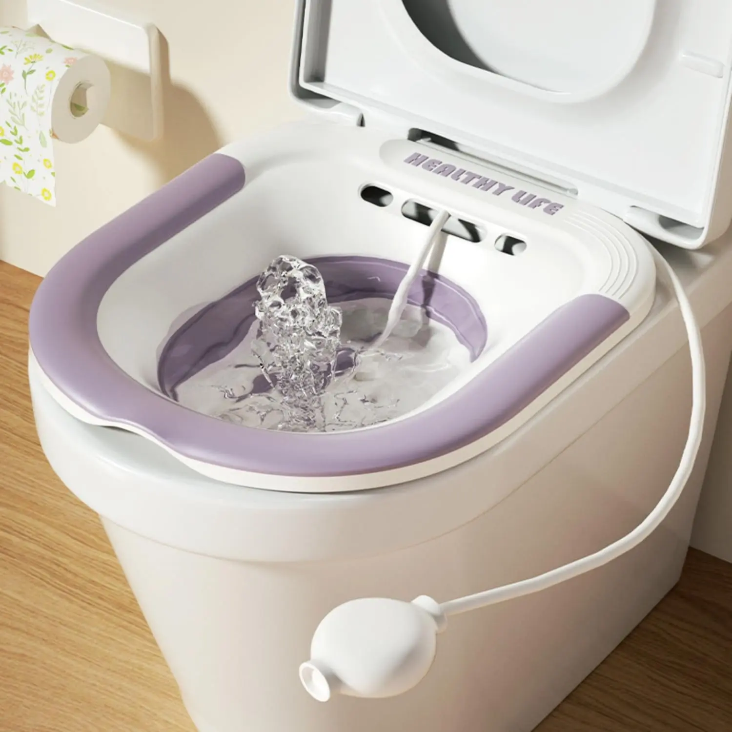 Foldable sitz bath basin for toilet seat offers comfortable postpartum care and hemorrhoid relief with a wider seating area and included flusher hose.