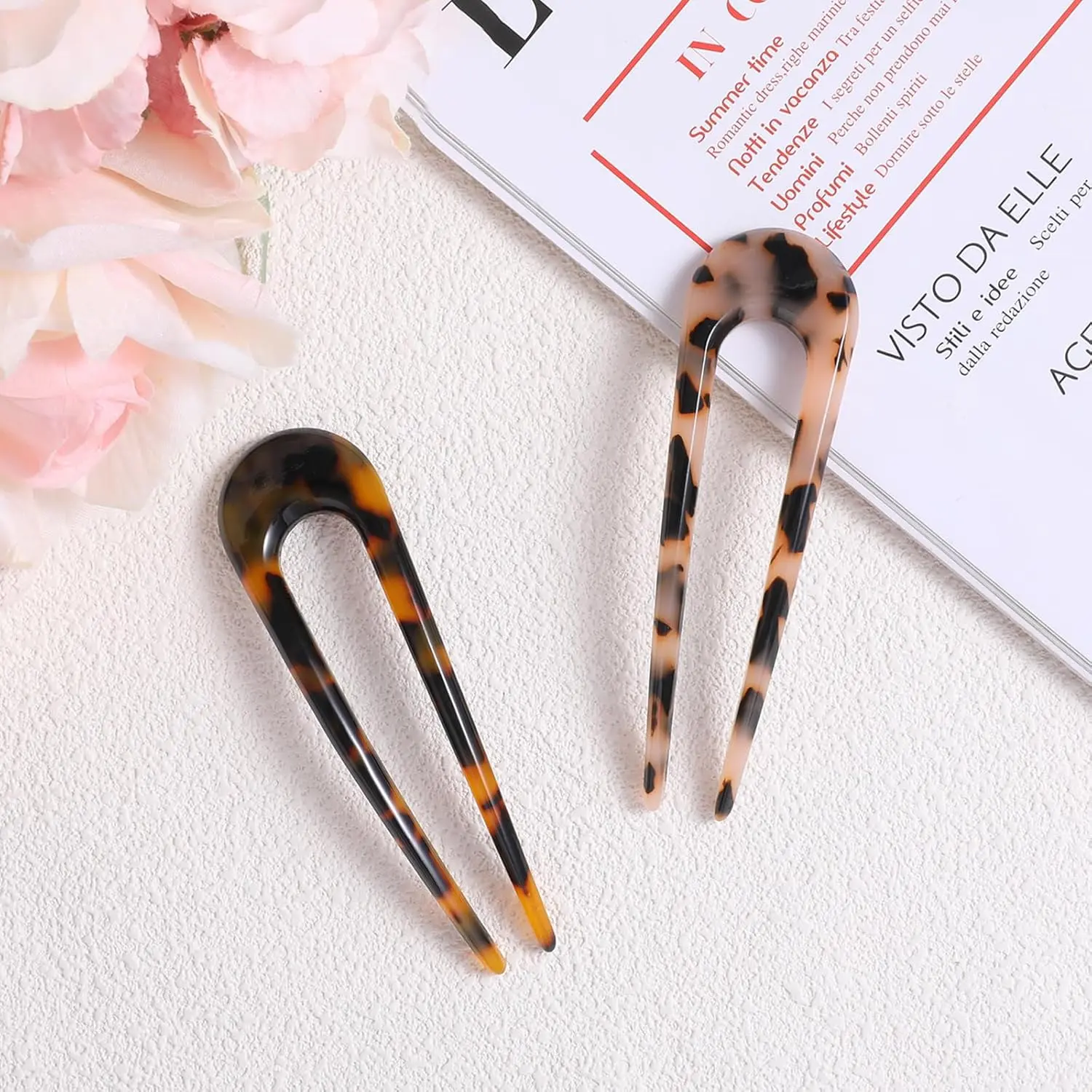 This image shows a set of two tortoise shell U-shaped hair forks, perfect for creating elegant French twists and buns for women and girls.