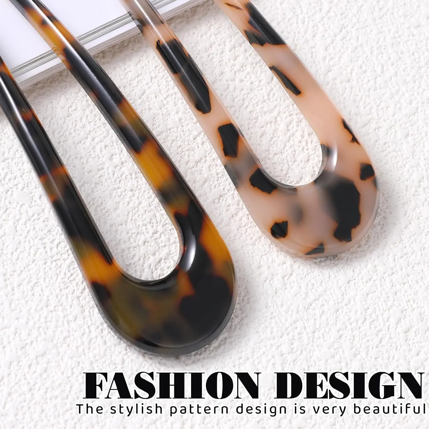 This image shows a set of two tortoise shell U-shaped hair forks, perfect for creating elegant French twists and buns for women and girls.