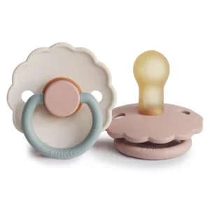 Two blush and cotton candy FRIGG Daisy pacifiers with a symmetrical cherry-shaped nipple, crafted from BPA-free natural rubber for babies 0-6 months.