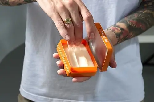 A jar of Fudge Urban Texture Junk hair cream provides a medium, flexible hold for styling men's hair.