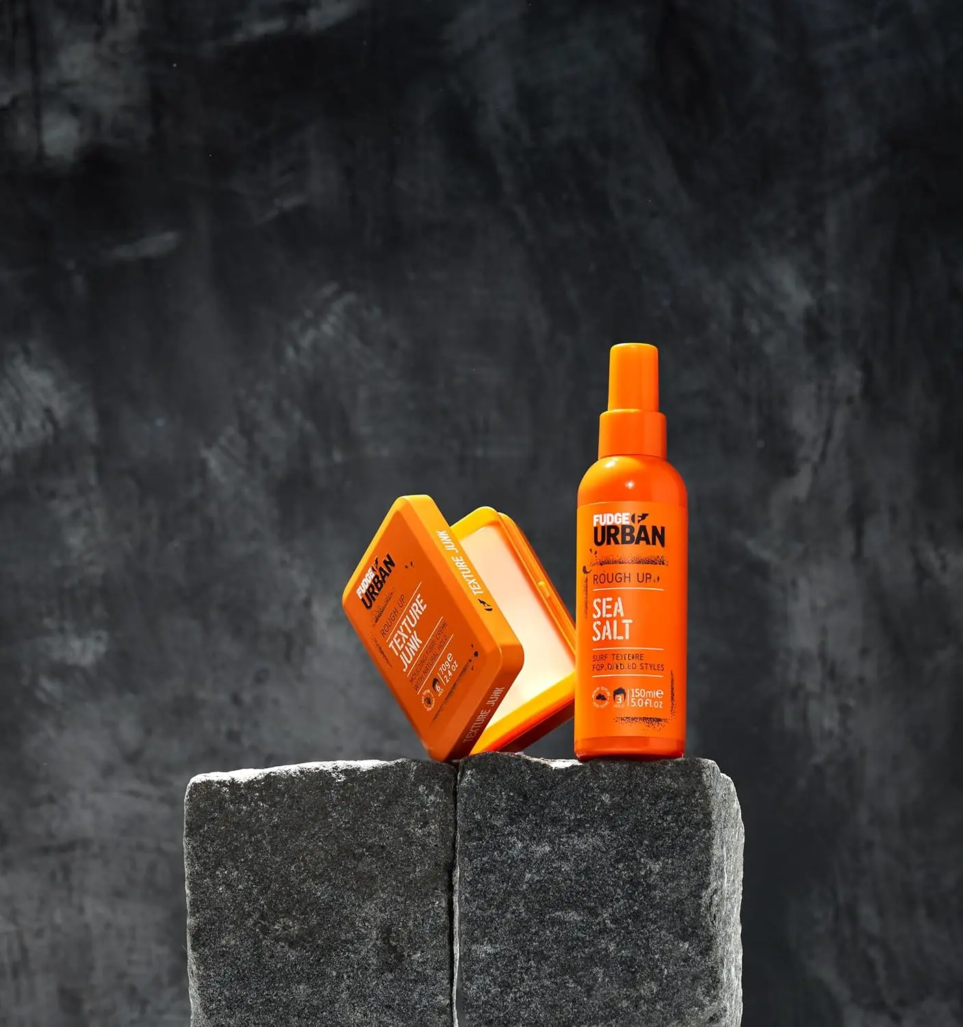 A jar of Fudge Urban Texture Junk hair cream provides a medium, flexible hold for styling men's hair.