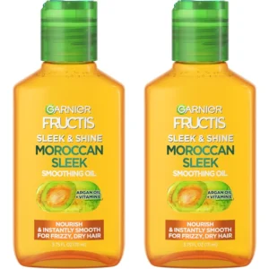 Two bottles of Garnier Fructis Sleek & Shine Moroccan Sleek Smoothing Oil infused with Argan Oil for controlling frizz and adding shine to dry hair.