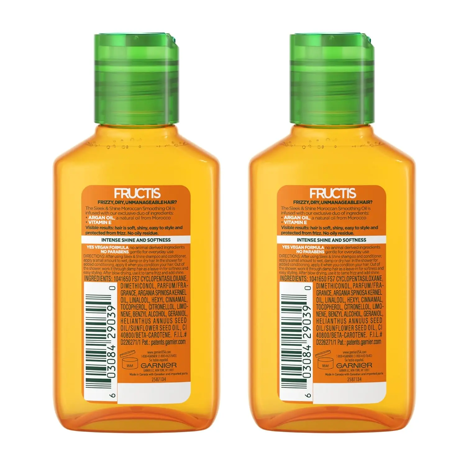 Two bottles of Garnier Fructis Sleek & Shine Moroccan Sleek Smoothing Oil infused with Argan Oil for controlling frizz and adding shine to dry hair.