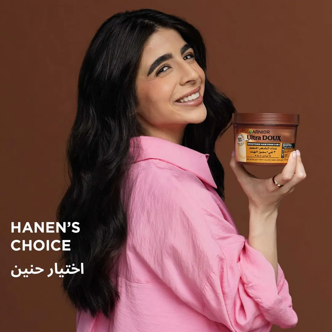 Garnier Ultra Doux Coconut and Macademia hair mask, a 98% natural origin formula supercharged with vitamins C, E, and F for smooth, frizz-free hair.