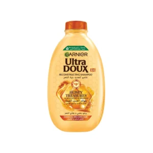 Bottle of Garnier Ultra Doux Honey Treasures Shampoo, an improved formula for a perfect, easy to use addition to your hair care collection.