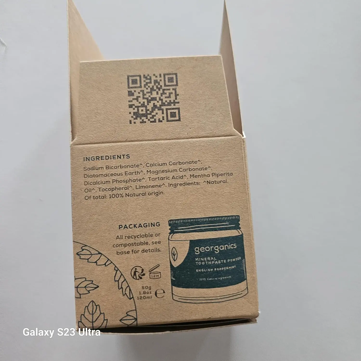 Georganics natural toothpowder in a glass jar, a vegan and cruelty-free stain-removing formula handmade in the UK.