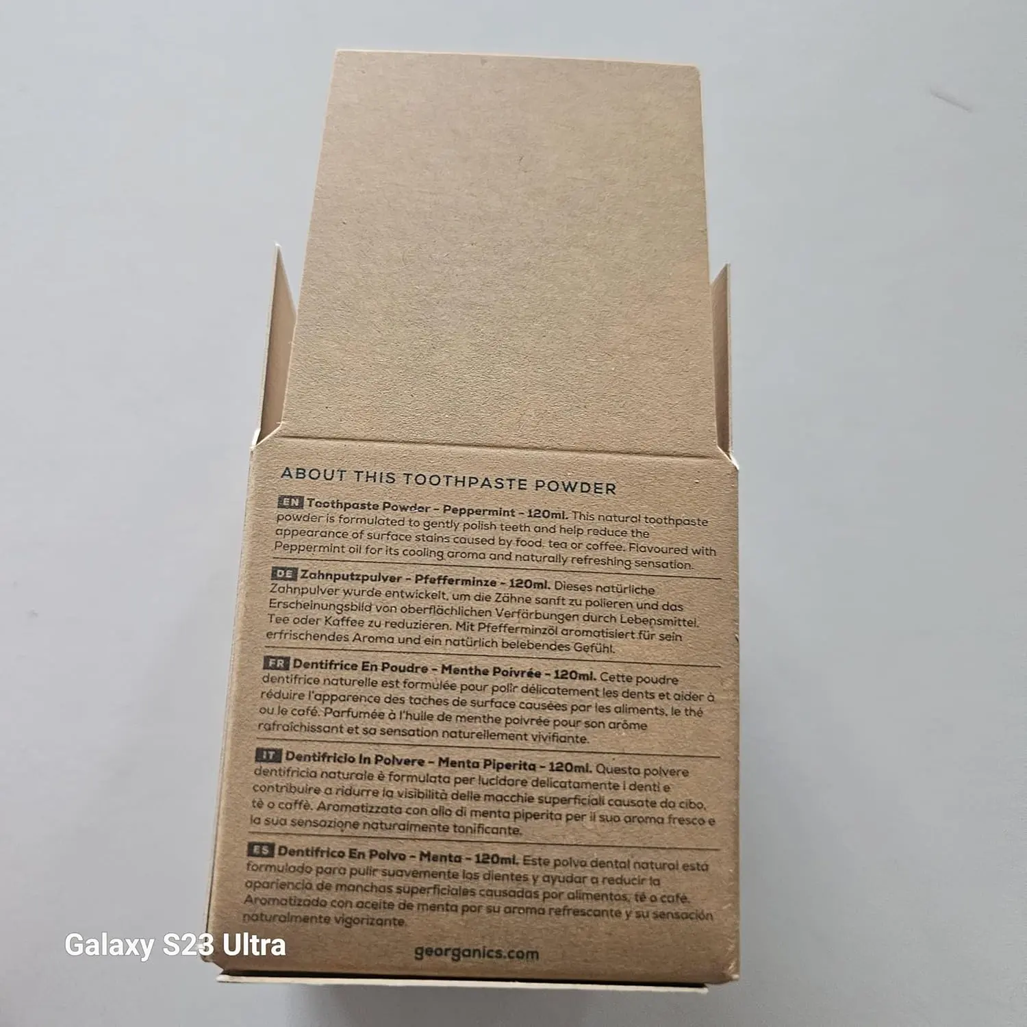 Georganics natural toothpowder in a glass jar, a vegan and cruelty-free stain-removing formula handmade in the UK.