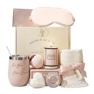 This luxurious spa gift set for women includes a wine tumbler, handmade soap, bath bomb, sleep mask, scented candle, and towel, making it the perfect birthday or Mother's Day gift.