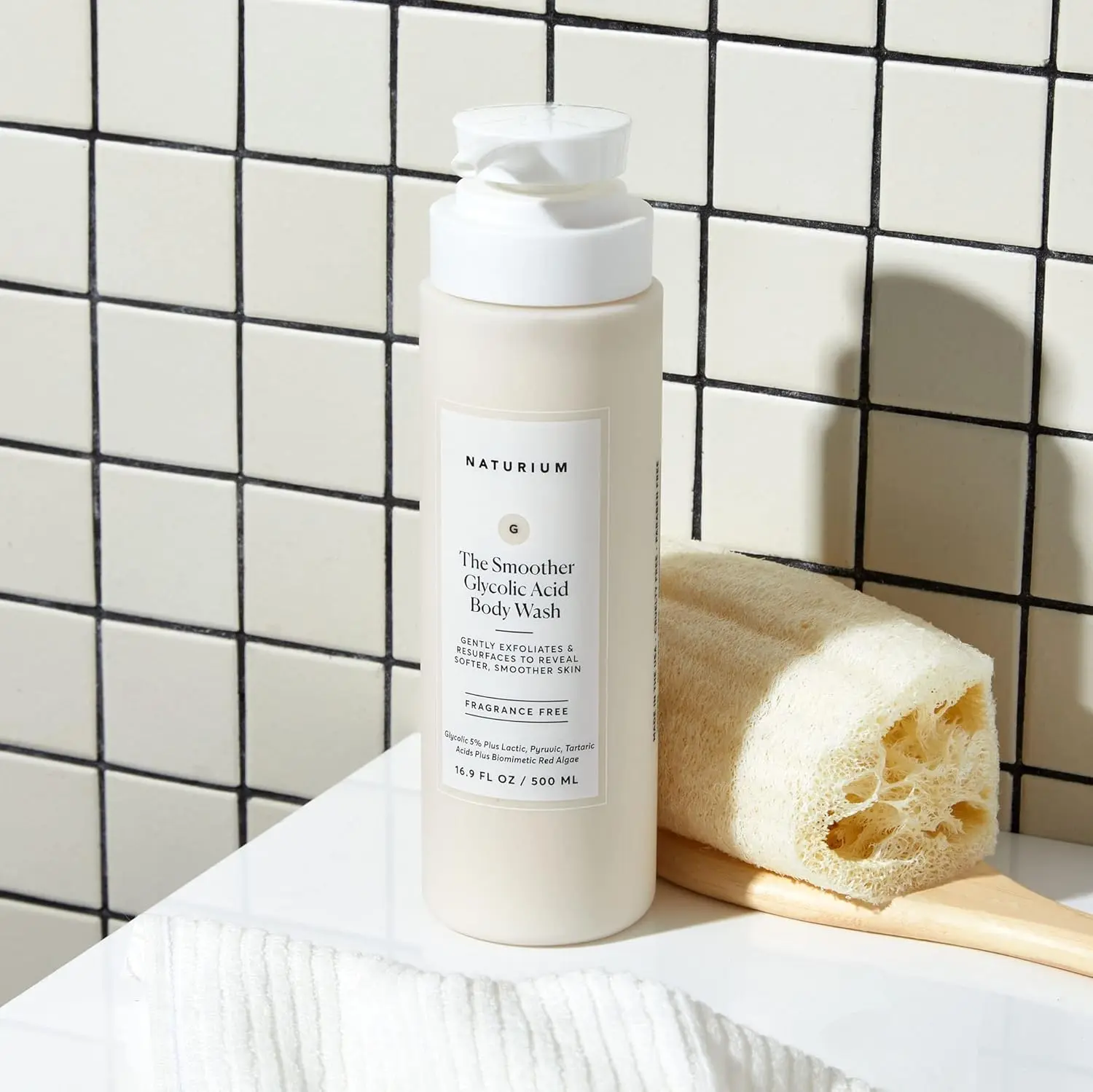 Naturium Glycolic Acid Exfoliating Body Wash gently cleanses and resurfaces rough skin, leaving it feeling softer and smoother.