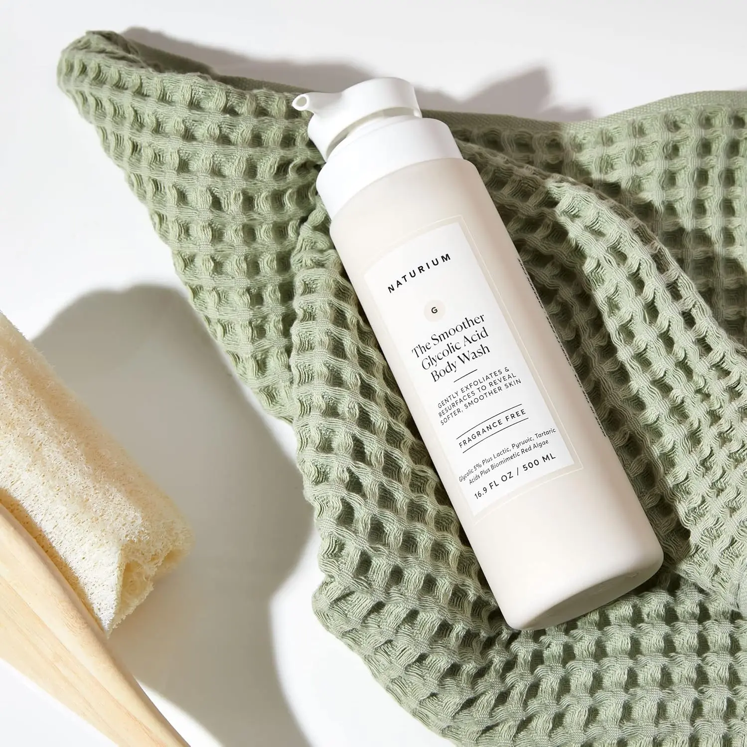 Naturium Glycolic Acid Exfoliating Body Wash gently cleanses and resurfaces rough skin, leaving it feeling softer and smoother.