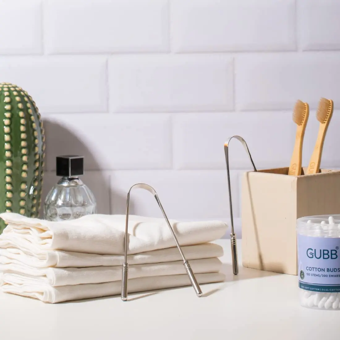 A pack of two GUBB metal tongue cleaners for adults and kids made by DR. MOREPEN LTD. helps to maintain oral hygiene.