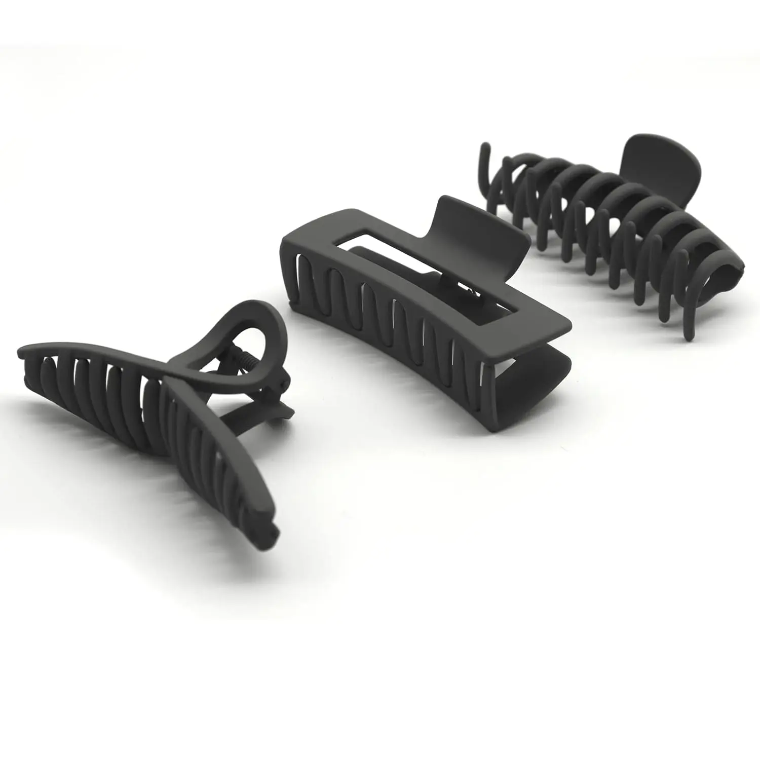 A pack of three large, non-slip hair claw clips designed to securely hold thick or thin hair, offering a stylish and lightweight hair accessory solution for women.