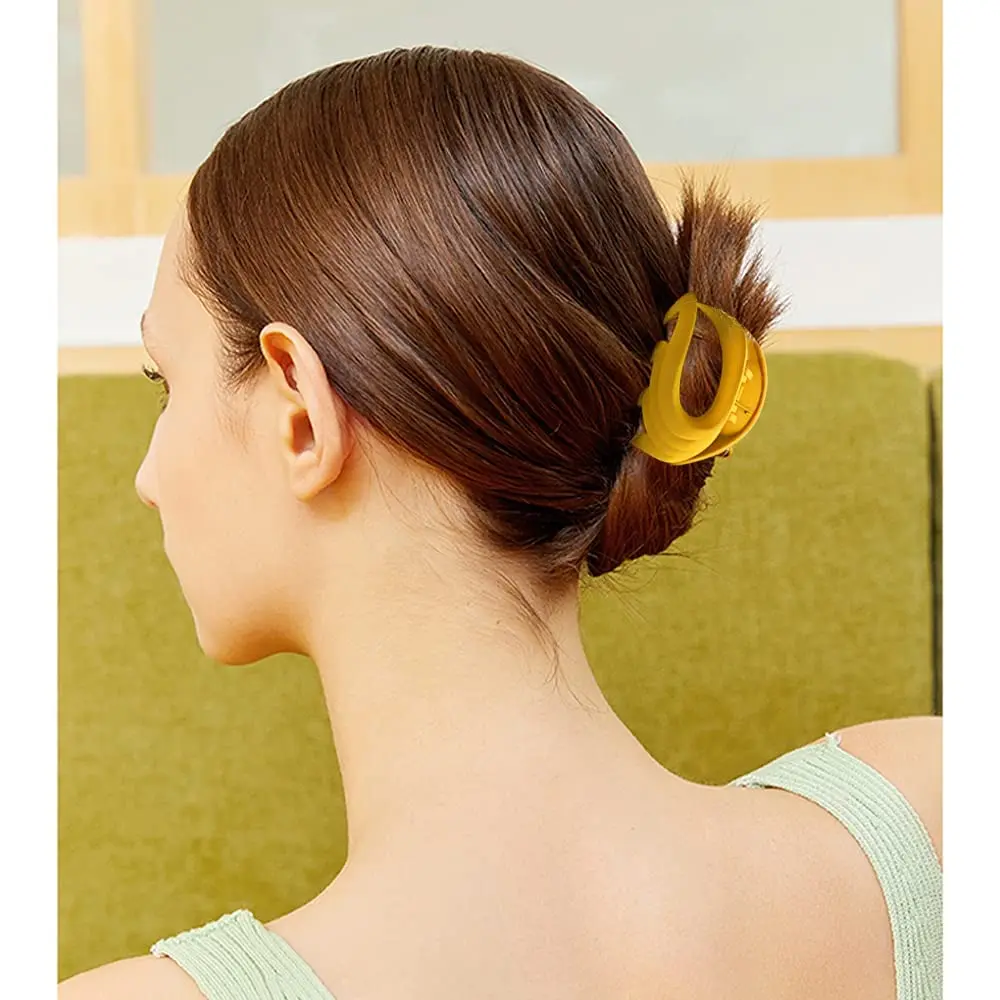 Six colorful flower claw hair clips are displayed, perfect for holding fine or thick hair in various styles for women and girls.
