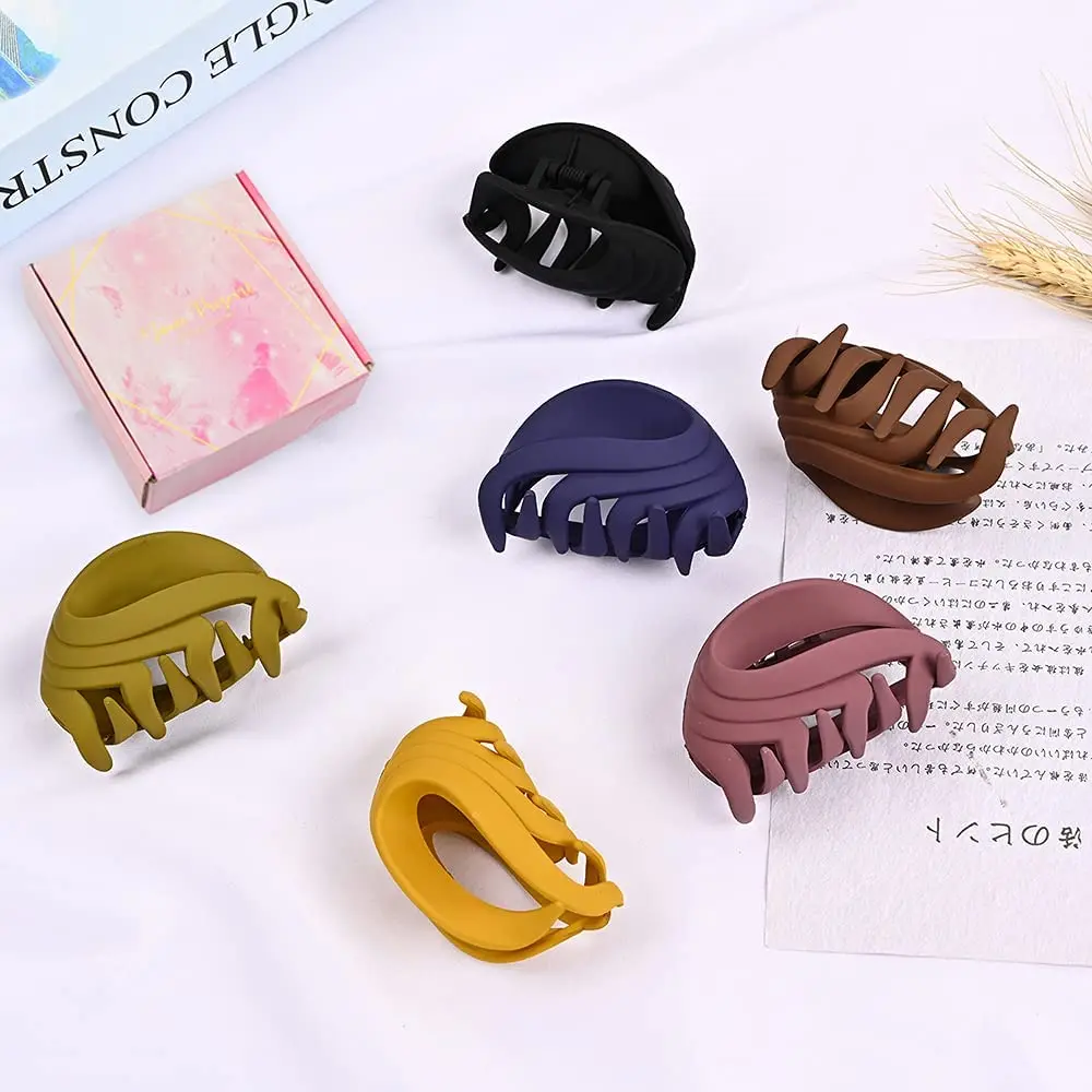 Six colorful flower claw hair clips are displayed, perfect for holding fine or thick hair in various styles for women and girls.