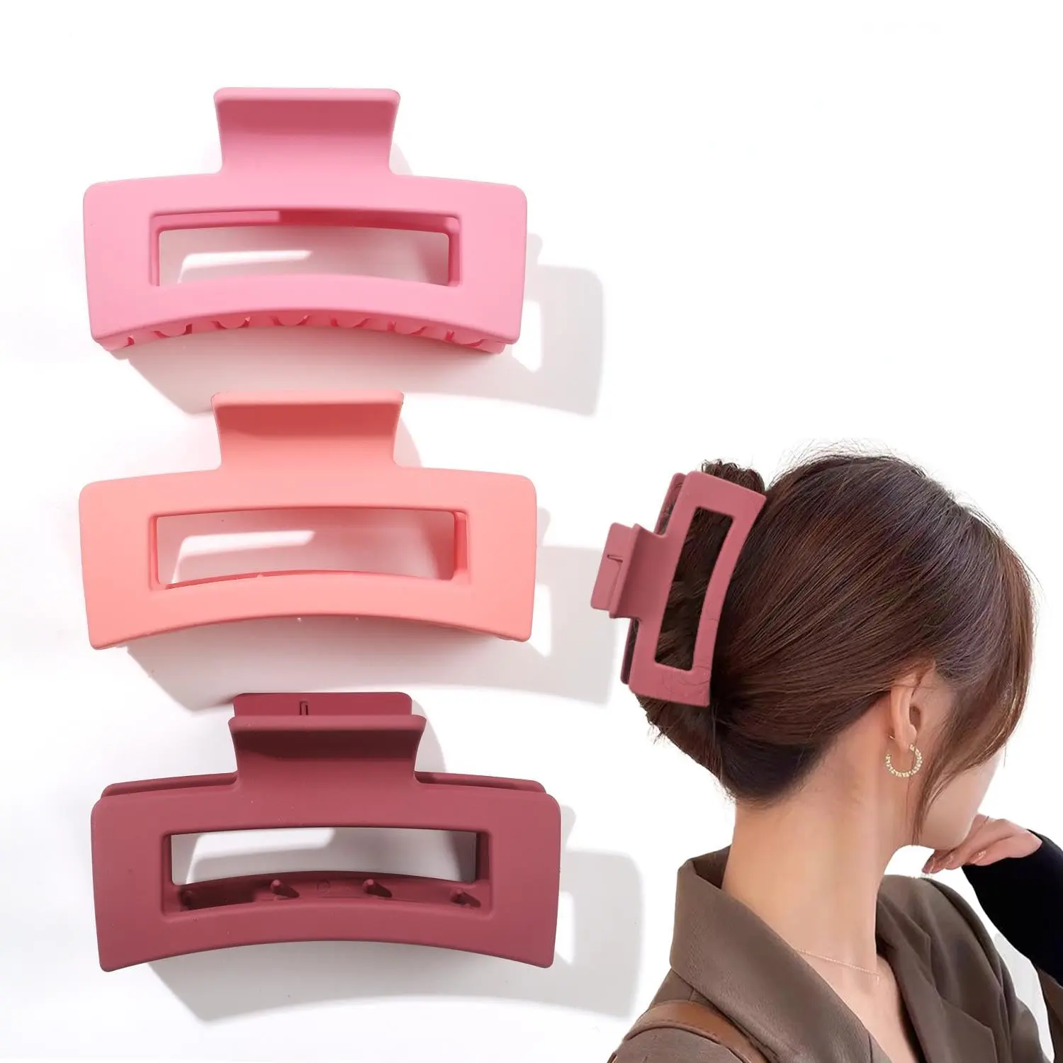 Three square hair claw clips in different colors securely holding thick hair for women.