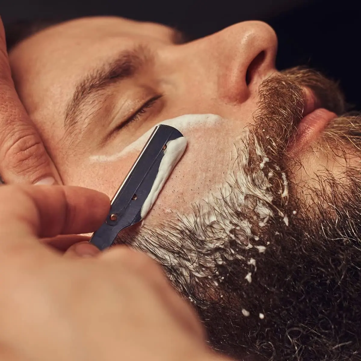 This 11-piece professional hair cutting kit includes stainless steel barber scissors, thinning shears, a straight edge razor, and other essential hairdressing tools for a salon-quality haircut at home.