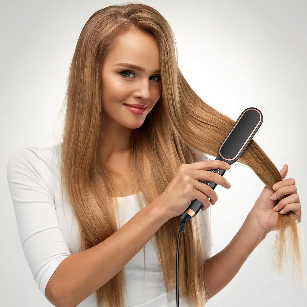 Black 3 in 1 hair straightener brush and comb with five temperature settings for creating smooth, salon-style hair at home.