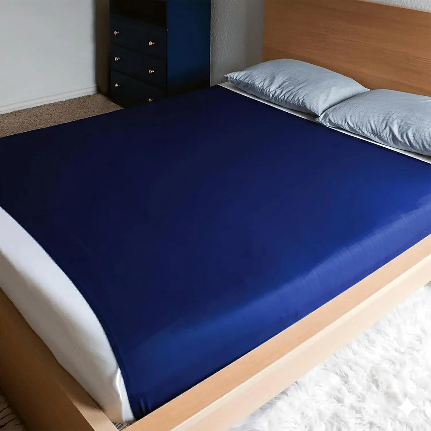 This cooling blue Harkla sensory compression sheet for kids offers a snug, calming fit on a full size bed, creating a comfortable sleep experience and helping reduce anxiety and restlessness.