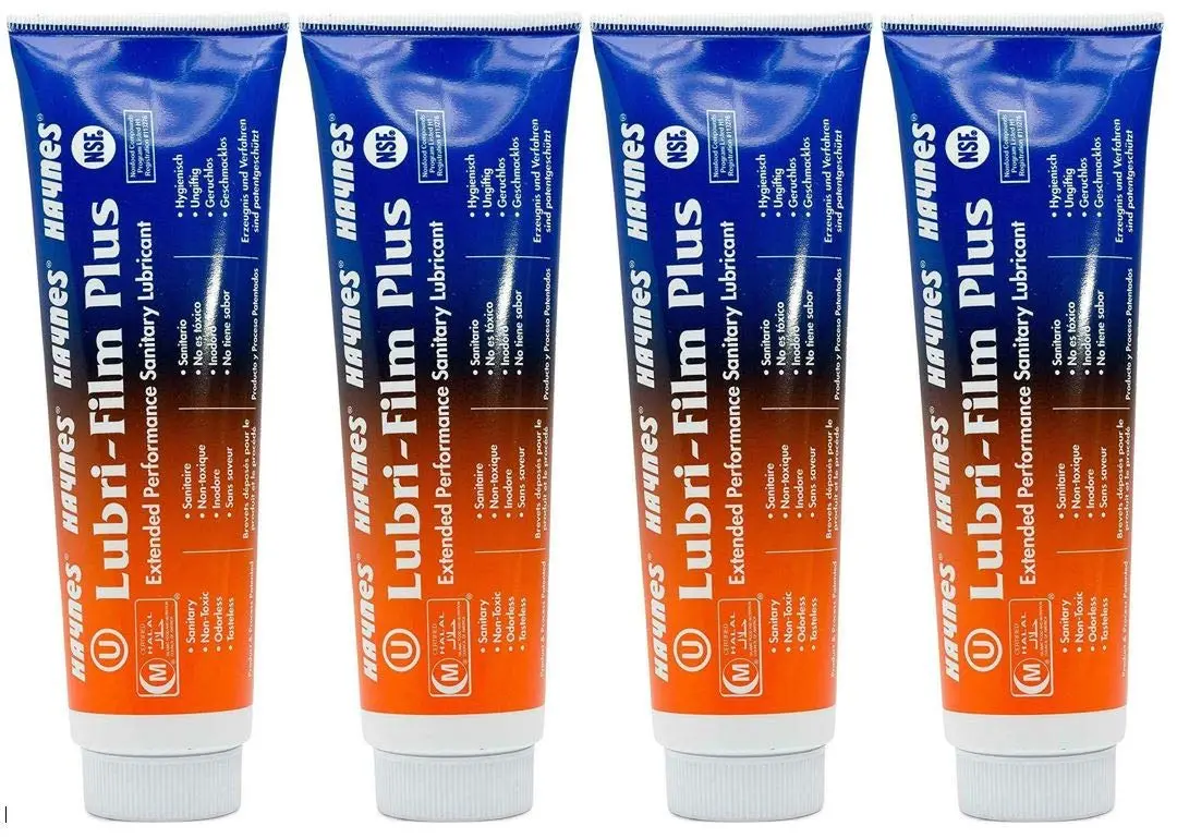 Four-pack of 4 oz Haynes Lubri-Film Plus lubricant for soft serve equipment, ensuring smooth operation and protection.