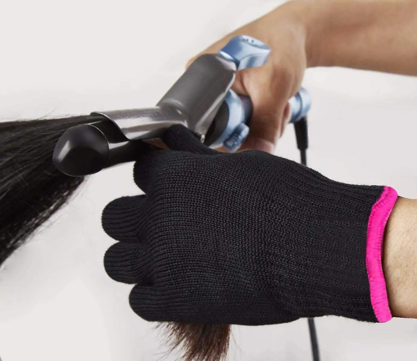 Two black heat resistant hair styling gloves protect hands from hot tools up to 212℉ while curling or straightening hair.