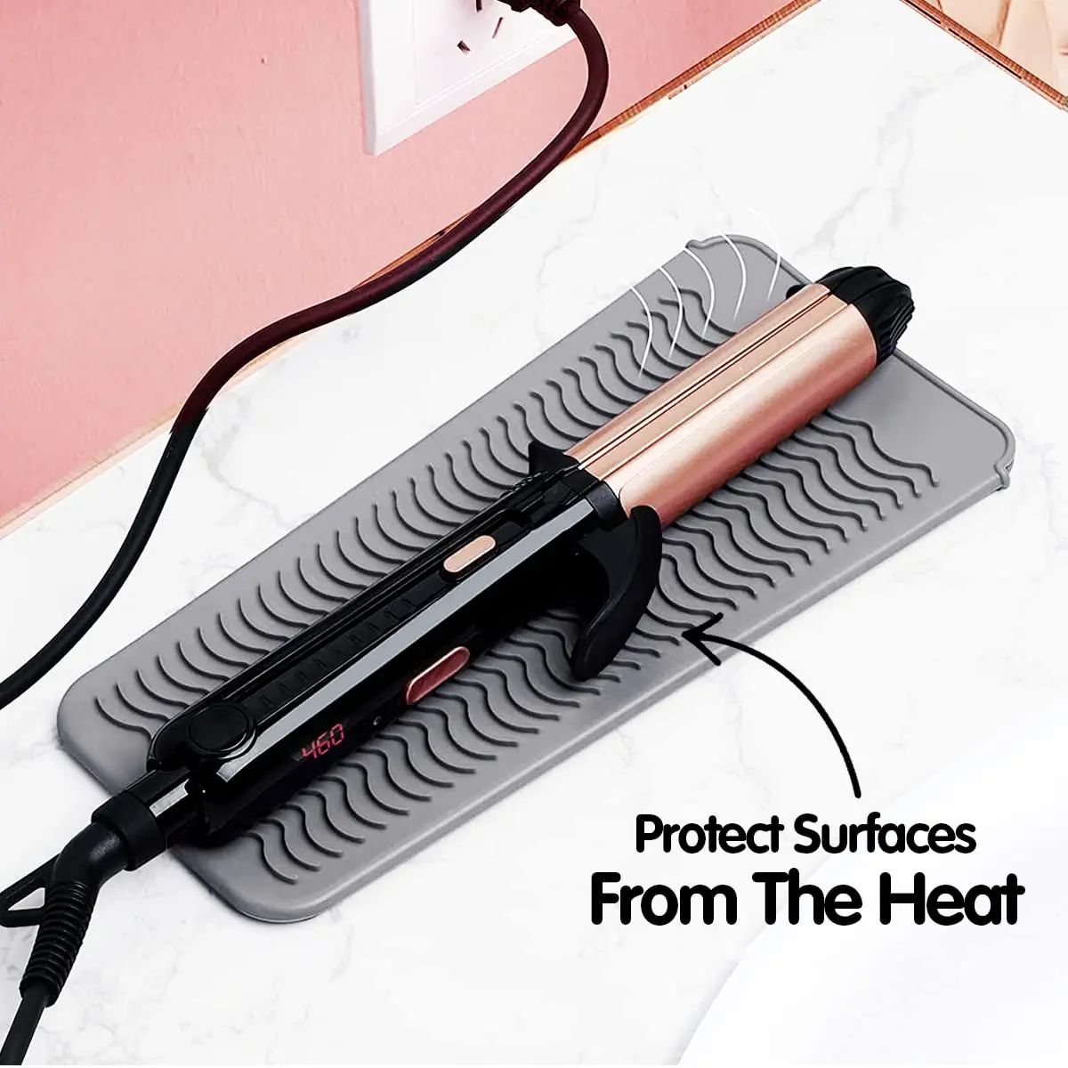 Heat resistant silicone mat pouch protects surfaces from hot curling irons and flat irons, doubles as a travel storage bag, and has an anti-slip surface.