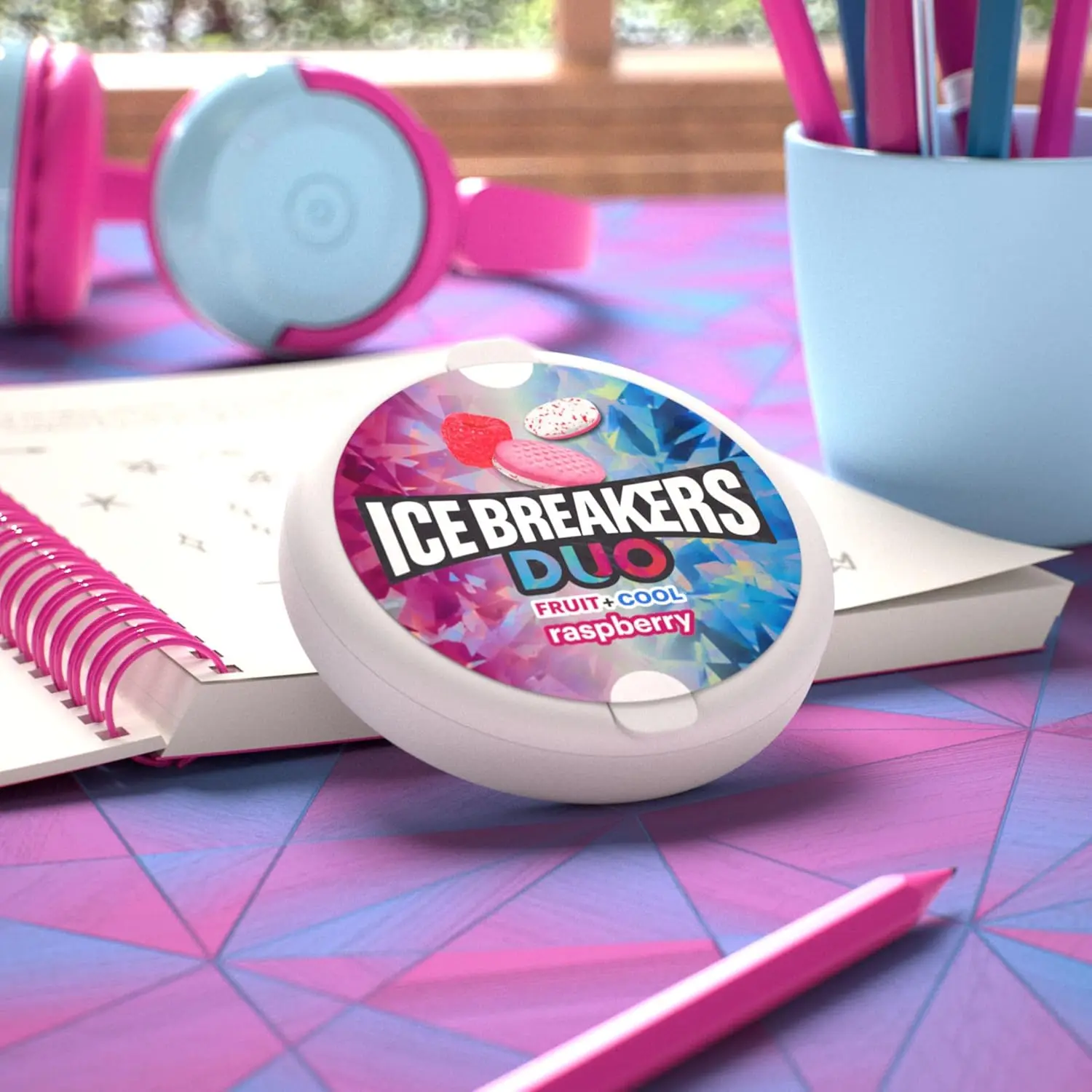 Eight tins of ICE BREAKERS DUO Raspberry flavored sugar free mints with cooling crystals for fresh breath on the go.
