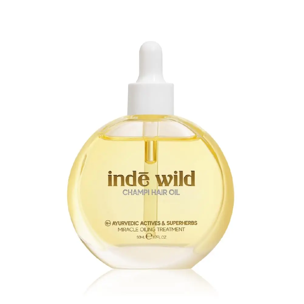 inde wild hair oil infused with Ayurvedic ingredients like Bhringraj, Brahmi, and Amla to strengthen hair, soothe the scalp, and promote healthy growth.