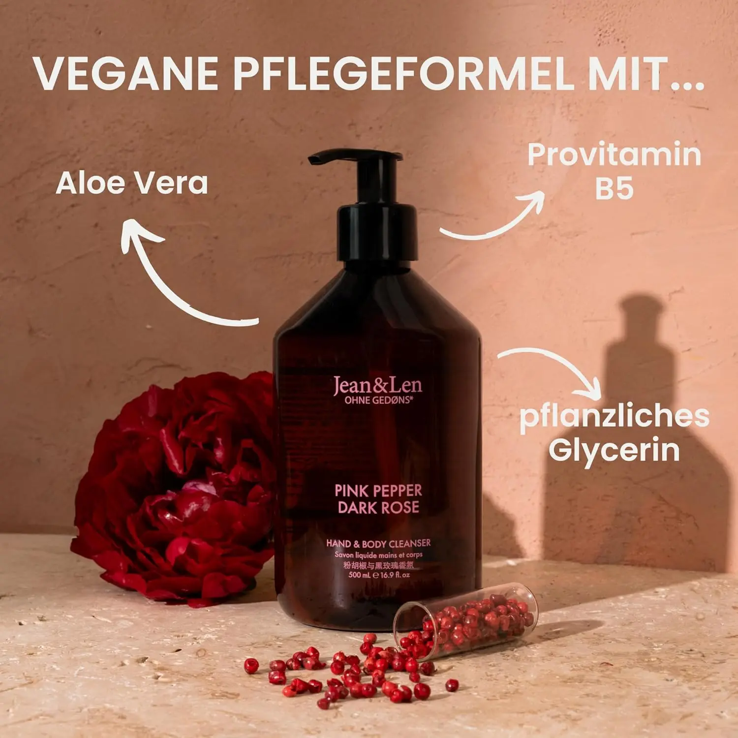 A bottle of Jean & Len Pink Pepper & Dark Rose hand and body cleanser, a vegan liquid soap with a sensual floral fragrance for a fragrant cleaning experience.