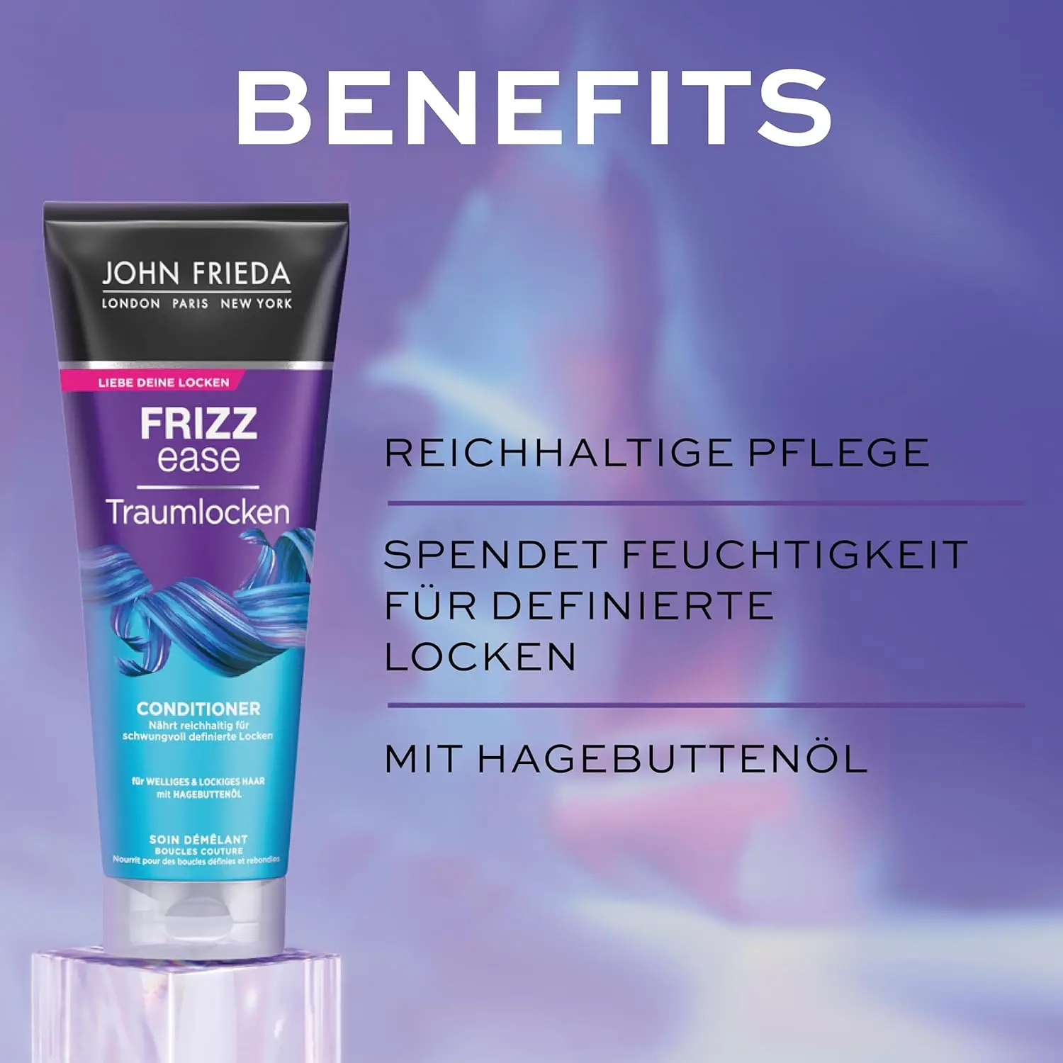 The John Frieda Dream Curls set with rosehip and Abyssinian oils includes shampoo, conditioner, and styling spray to cleanse, nourish, and define frizzy, curly, or wavy hair for bouncy curls.