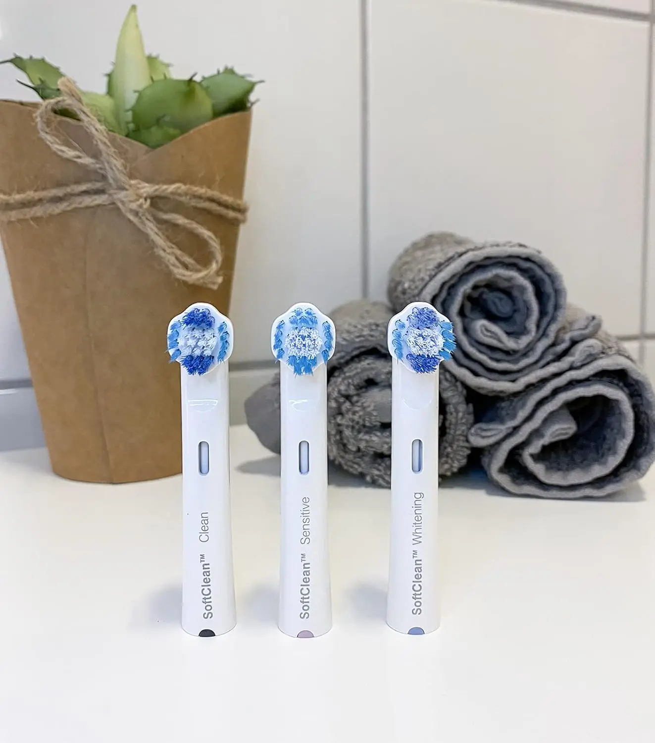 A small, white Jordan Clean Smile whitening brush head effectively removes plaque and stains, offering thorough and gentle cleaning for compatible electric toothbrushes.