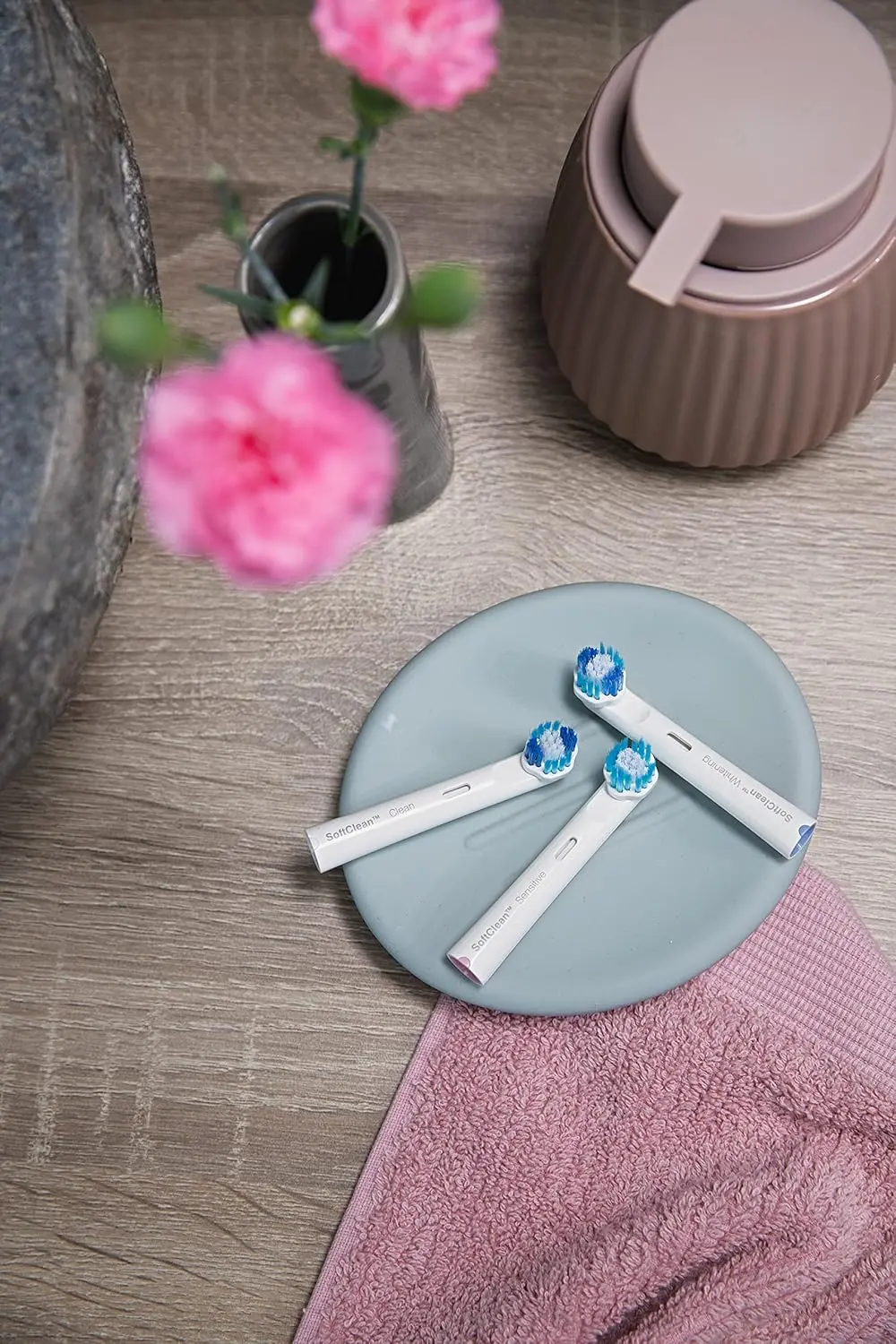 A small, white Jordan Clean Smile whitening brush head effectively removes plaque and stains, offering thorough and gentle cleaning for compatible electric toothbrushes.